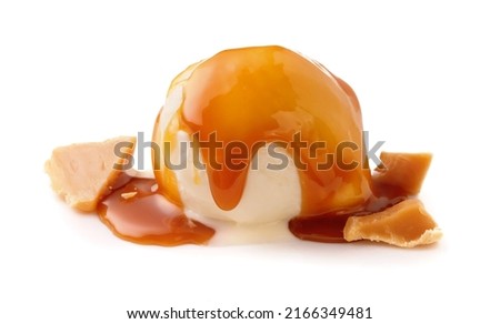 Ice cream ball with caramel cubes and caramel sauce on white. Ice cream isolated.