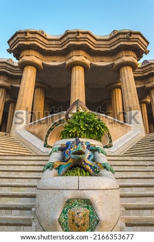 Entrance to hypostyle room with multicolored mosaic salamander in Park Guell, Barcelona, Spain Royalty-Free Stock Photo #2166353677
