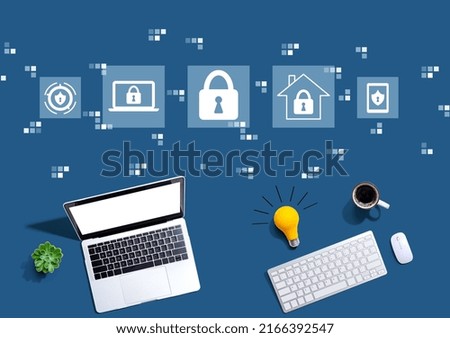 Cyber security theme with computers with a light bulb from above