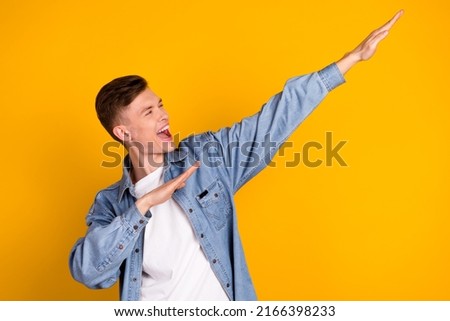 Photo of young excited man have fun dance look empty space clubber isolated over yellow color background Royalty-Free Stock Photo #2166398233