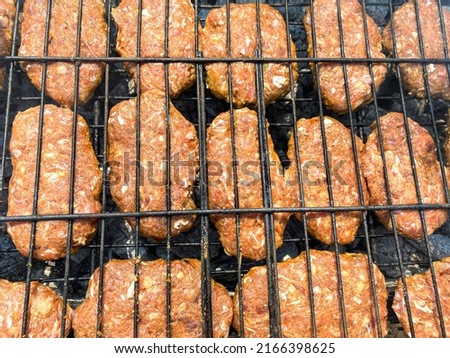 meatballs on the grill. raw meatballs cooked on the barbecue