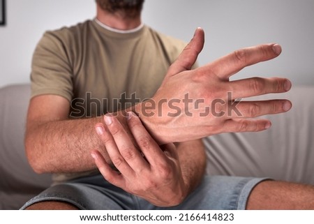 Adult man with hand and wrist pain.