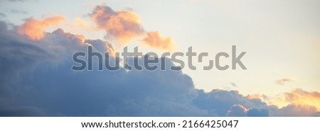 Clear blue sky, red, pink, golden cirrus and cumulus clouds after storm. Dramatic sunset cloudscape. Concept art, meteorology, heaven, hope, peace, graphic resources, picturesque panoramic scenery Royalty-Free Stock Photo #2166425047