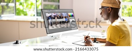 Designer Editing Photo On Computer In Office