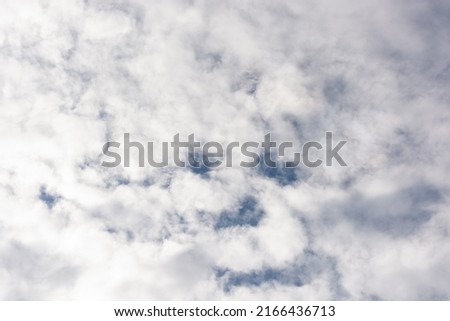 Cloudy. Clouds with similar face-like elements. Watch from heaven. Royalty-Free Stock Photo #2166436713