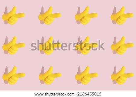 Bright yellow pointer symbol icon on pastel pink background. Hand gesture, attention or essence concept. Seamless pattern, isometric view.