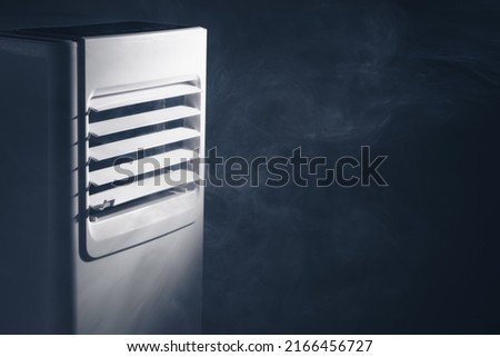 air conditioner louvers outlet with cold steam, close-up view