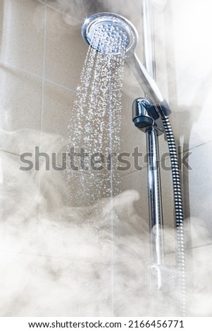 contrast shower with flowing water and steam Royalty-Free Stock Photo #2166456771