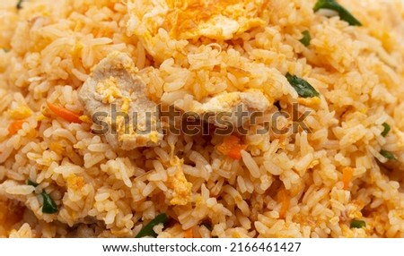 Fried rice in white plate on white background.