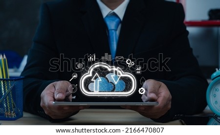 Creative background, a male hand with the iPad, the image of the hologram of the cloud, The concept of cloud technology, cloud storage, and a new generation of networks. Mixed media.