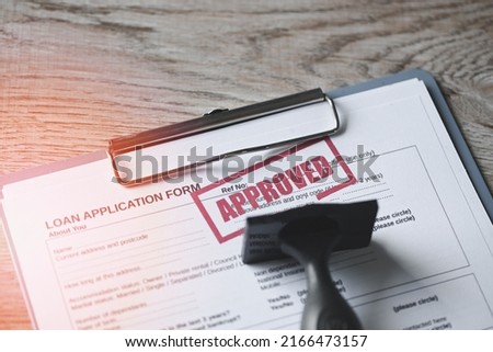 Loan approved on loan application form paper with rubber stamp on table, Loan approval business finance economy concept Royalty-Free Stock Photo #2166473157