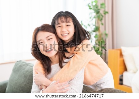 young asian mother and daughter