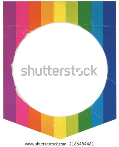 Old, weathered rainbow colored cardboard matte picture frame with circular cutout.