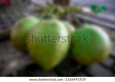 a collection of several young coconuts