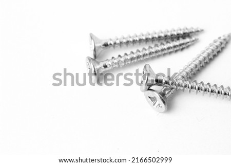 Macro photography of screws on white background