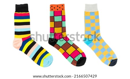 One sock with different lines isolated on white background. Colorful sock son white background. Colored socks on the leg isolated on white background Royalty-Free Stock Photo #2166507429