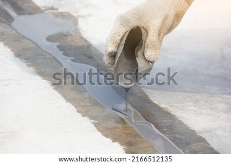 Epoxy injection to repair the floor crack coating Royalty-Free Stock Photo #2166512135