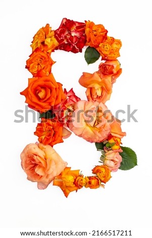 Number 8 made with real red orange roses, isolated on white background.