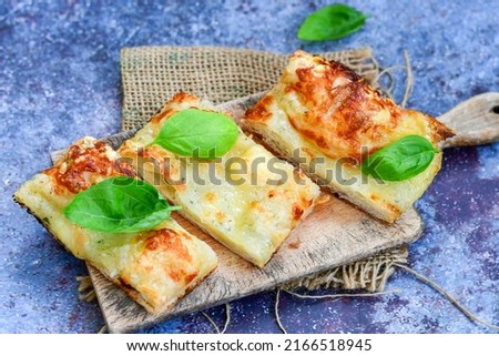   Italian  Focaccia  four cheese with crispy crust   Full 72 hour pizza dough   fermentation   method. Roman style pizza slice 