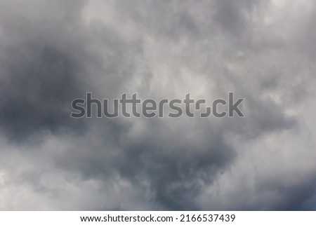 Сloudy dramatic rainy sky background. Panoramic view with beautiful stormy clouds. Horizontal cloudscape. High-resolution photography. Design element. Copy space. 