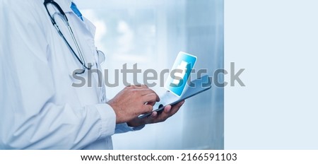 Banner of A Doctors are using Check the information on the digital tablet, find the medical history of the patient at the hospital. Concept of medical care and technology.