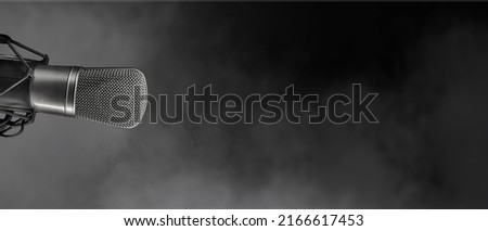 studio condenser microphone isolated on black. With copy space