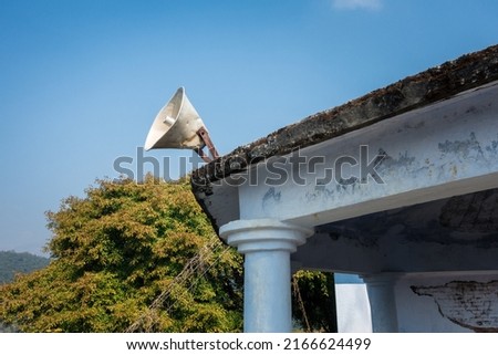 A loud speaker on a building roof of a worshiping place. Uttarakhand India.