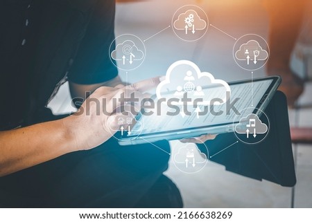 remote work, born in cloud and digital native business concept. man use Digital tablet with cloud economic team diagram show virtual desktop. Cloud technology. modernization business Royalty-Free Stock Photo #2166638269
