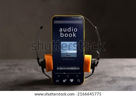 Listen audiobook online concept, online music player app on smartphone. Streaming service. Royalty-Free Stock Photo #2166645775