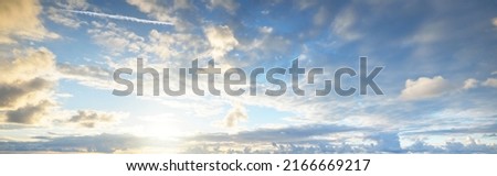 Ornamental clouds. Dramatic sky. Epic storm cloudscape. Soft sunlight. Panoramic image, texture, background, graphic resources, design, copy space. Meteorology, heaven, hope, peace concept Royalty-Free Stock Photo #2166669217