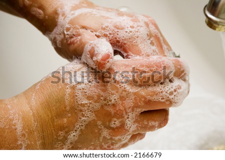 Women washing hands in white sink good suds Royalty-Free Stock Photo #2166679