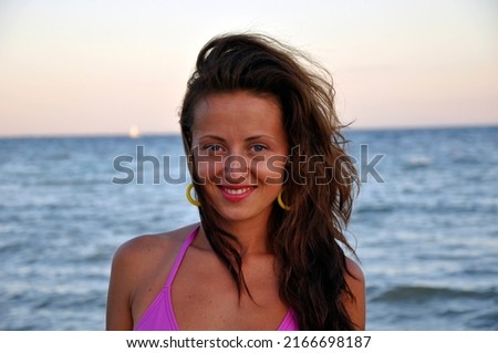 happy young latin woman at sea beach.