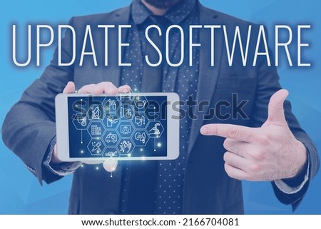Text sign showing Update Software. Business approach replacing program with a newer version of same product Man holding Screen Of Mobile Phone Showing The Futuristic Technology.
