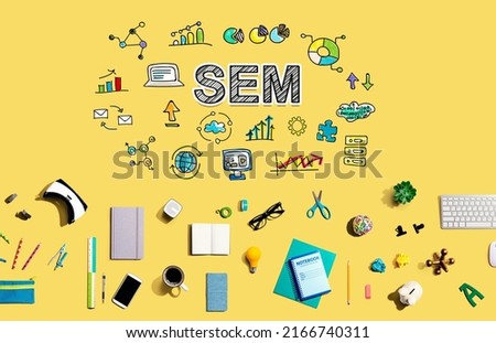 SEM with collection of electronic gadgets and office supplies