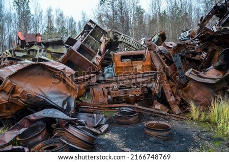 Piles of old rusty soviet crushed trucks in scrap metal yard. Car recycling Royalty-Free Stock Photo #2166748769
