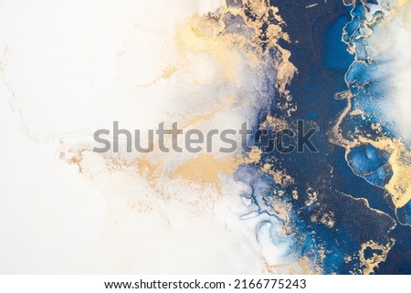 Marble ink abstract art from exquisite original painting for abstract background . Painting was painted on high quality paper texture to create smooth marble background pattern of ombre alcohol ink . Royalty-Free Stock Photo #2166775243