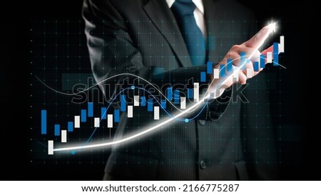 Businessman draw finance allusive graph chart showing business profit growth increasing to future target . Excellent financial status of corporate business rise up . Finance and money technology . Royalty-Free Stock Photo #2166775287