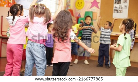 Dancing to get rid of all the energy. Preschool students jumping and dancing around having fun.
