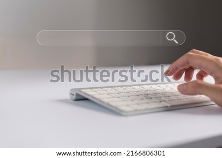 Search technology, search engine optimization, man's hand using computer keyboard to search information, using search bar function on your website. SEO.