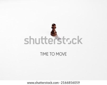 Chess pawn with the message time to move. Royalty-Free Stock Photo #2166856059