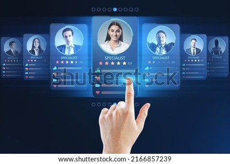 Human resources information system and specialist marketplace with human finger on digital touch screen with personal cards with rating