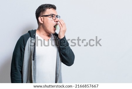 Handsome man with bad breath and halitosis problem, People with bad breath problem, Concept of person with halitosis and bad breath Royalty-Free Stock Photo #2166857667