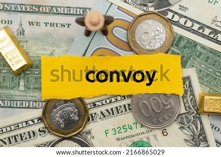 convoy.The word is written on a slip of paper,on colored background. professional terms of finance, business words, economic phrases. concept of economy.