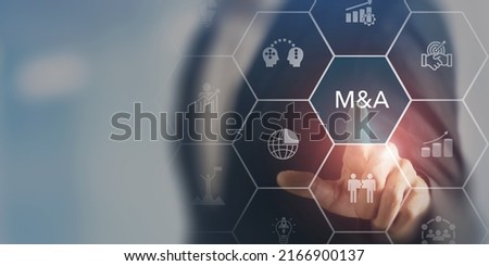 Business mergers and acquisitions concept. Share acquisition, asset business acquisition, amalgamation. Business review and development model. The abbreviation M and A on smart background, copy space. Royalty-Free Stock Photo #2166900137