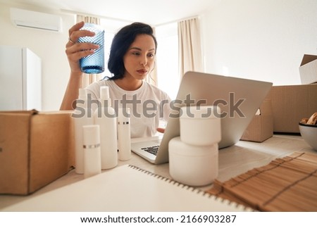 Concentrated Internet store employee processing customer order
