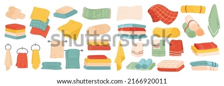 Towels set in different colors and patterns vector illustration. Cartoon fabric spa, beach, bath or kitchen soft napkin, stack or roll of cotton cloth isolated white. Hygiene, laundry concept Royalty-Free Stock Photo #2166920011