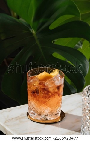 Negroni, an italian cocktail, an apéritif, first mixed in Firenze, Italy, in 1919. Count Camillo Negroni asked to strengthen his Americano by adding gin rather than normal soda water. Royalty-Free Stock Photo #2166923497