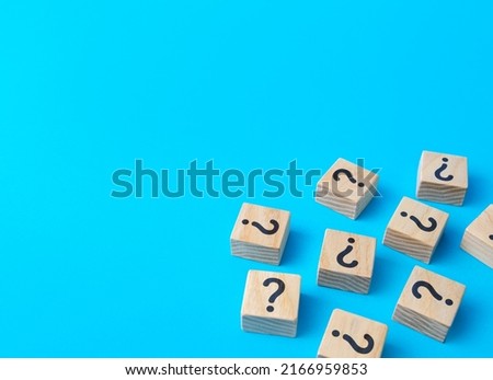 Scattered blocks with a question mark. Lots of unknown facts. Analytics and analysis of information. Curiosity, exploration. Induction, deduction. Confusing business. Questions and problem solving. Royalty-Free Stock Photo #2166959853