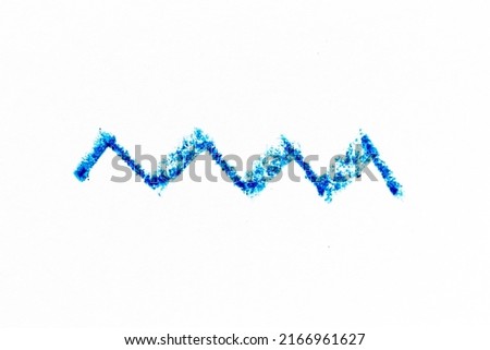Blue color crayon hand drawing in zigzag line shape on white paper background