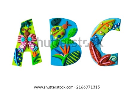 Clay handmade letter text for children nursery age. Tropical butterflies, jungle decorative art isolated on white background.